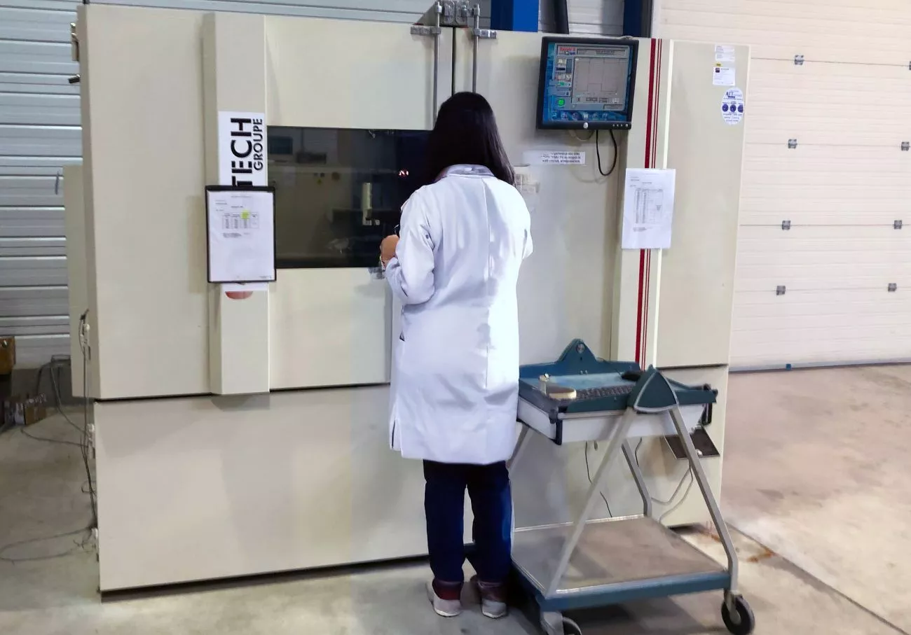 Test operator in front of her thermal shock test chamber